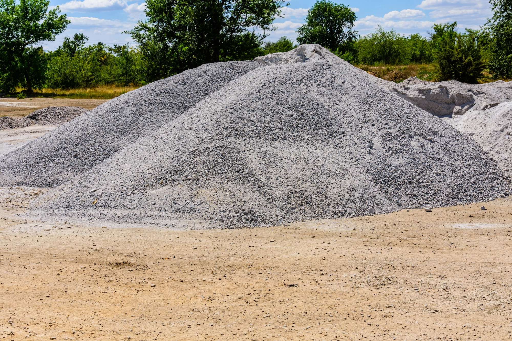 Pile of crushed gravel and landscape rock at a bulk supply yard in Norman, Oklahoma