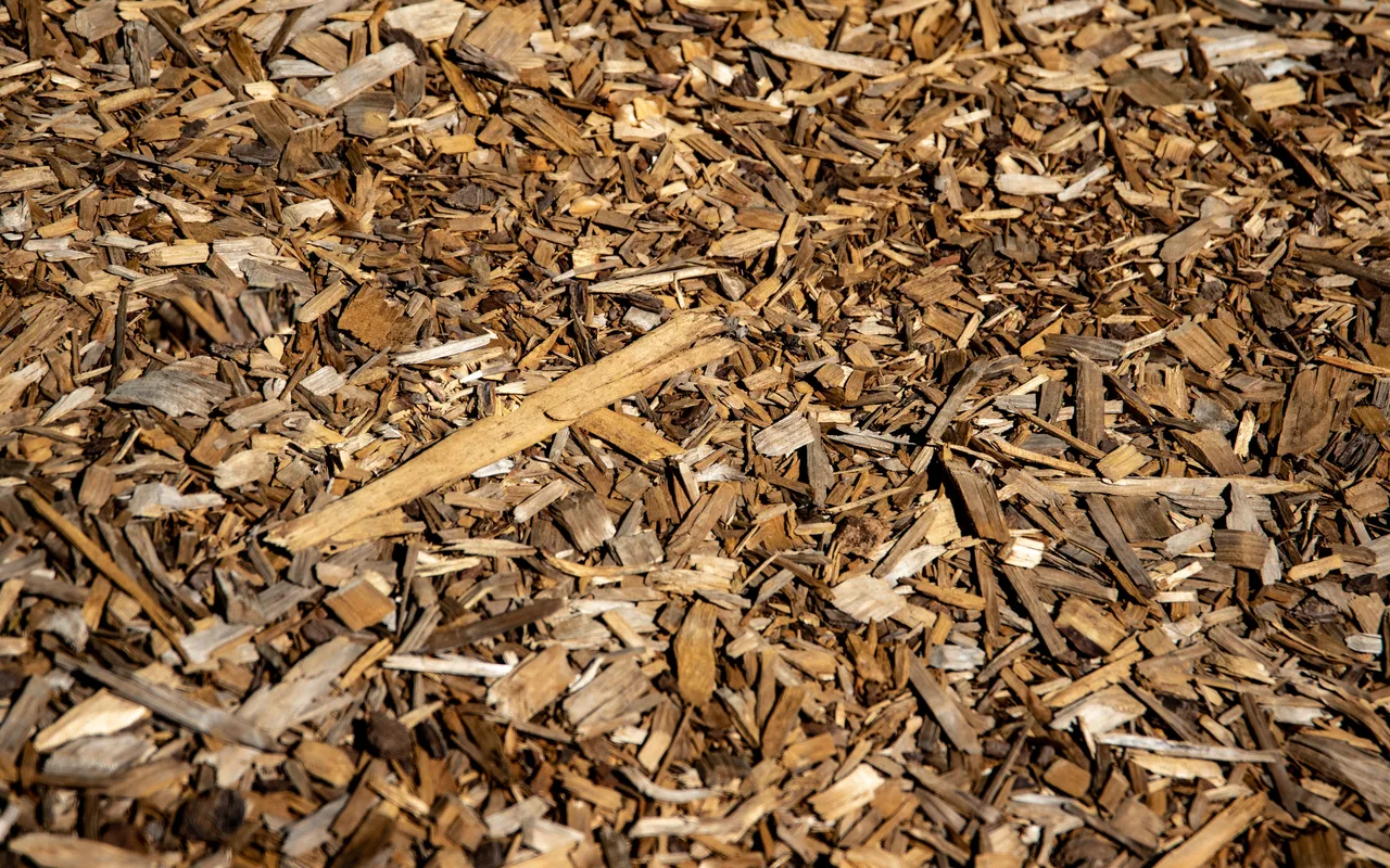 Close-up of natural brown bark mulch sold in bulk by the cubic yard
