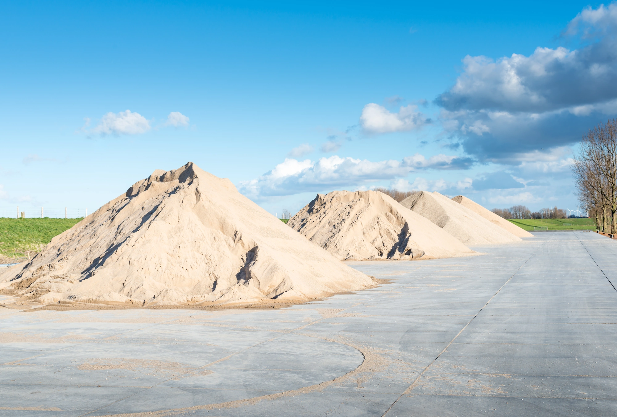 Bulk sand piled at a landscaping supply yard in Norman, Oklahoma