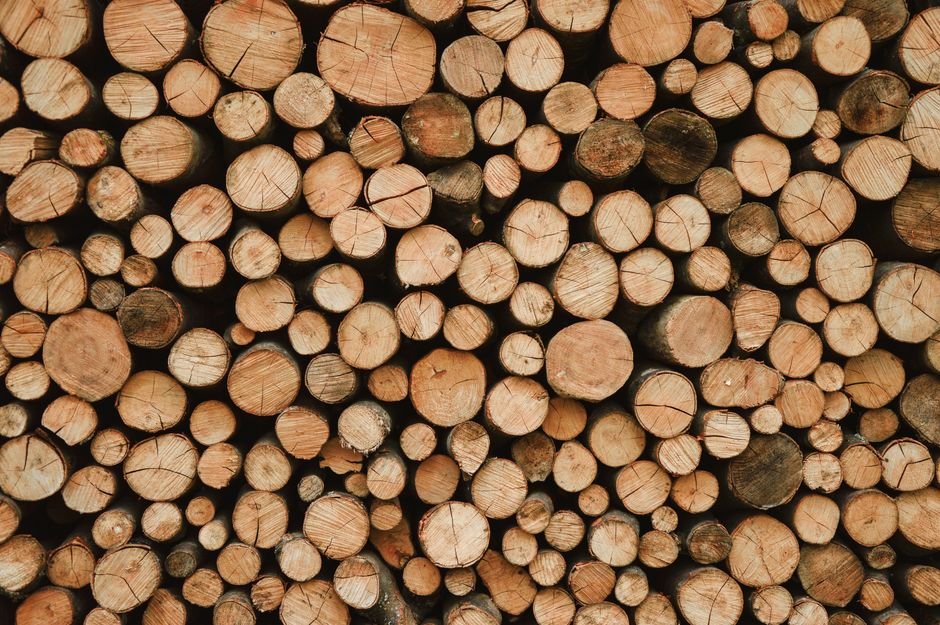 Stacked firewood pile for sale by the cubic yard in Norman, Oklahoma